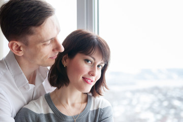 young couple at   window