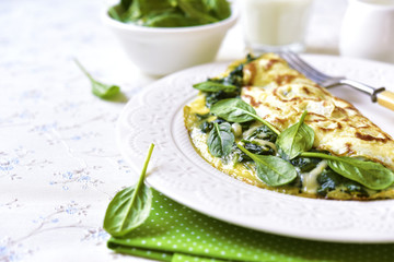 Omelette stuffed with spinach and cheese.