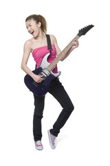 Young woman playing an electric guitar