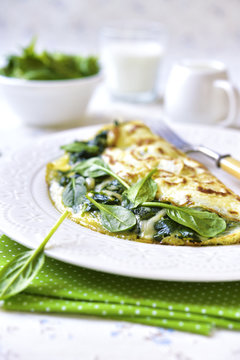 Omelette stuffed with spinach and cheese.