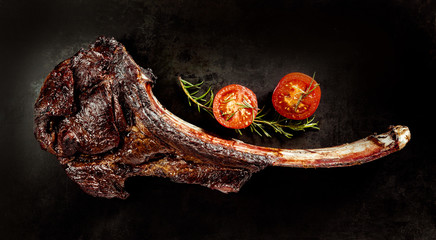 Succulent grilled tomahawk beef steak - obrazy, fototapety, plakaty