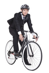 Naklejka premium young businessman riding a bike