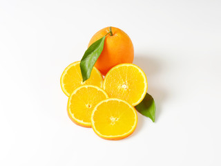 Fresh ripe oranges with leaves