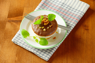 Chocolate glazed walnut muffin