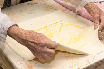 Grandmother making puff pastry