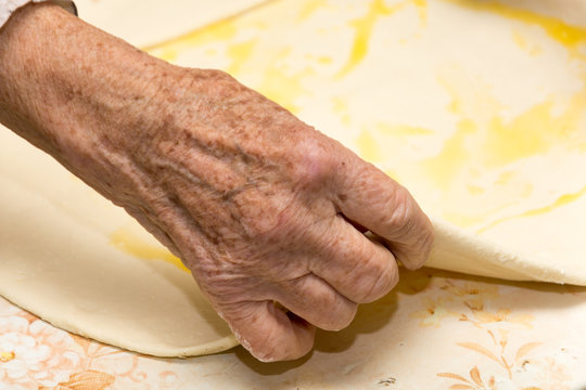 Grandmother making puff pastry