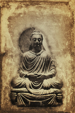 Vintage sepia toned seated Buddha statue
