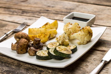 Grilled vegetables on white plate.