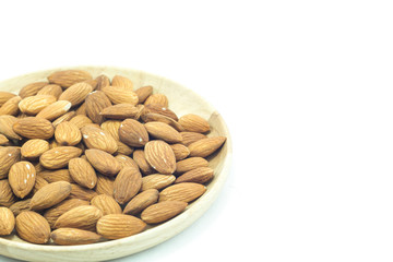 Plate of almond isolated on white background