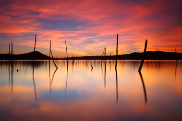 Fototapeta na wymiar Beautiful sunset over a peacefull lake