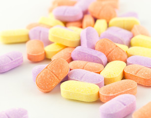 colorful antibiotic tablets on white