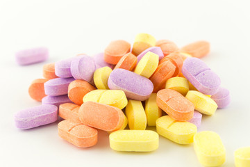 colorful antibiotic tablets on white