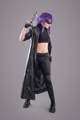 Woman with gun / Portrait of sexy woman posing in studio with gun