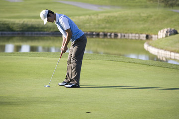 Golfer putting on the Green
