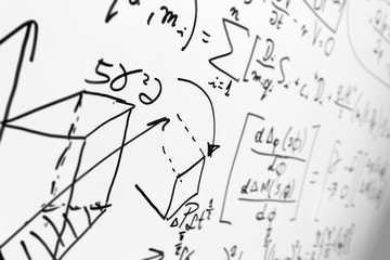 Complex math formulas on whiteboard. Mathematics and science with economics