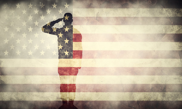 Double exposure of saluting soldier on USA grunge flag. Patriotic design