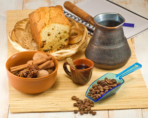 cup of coffee, coffee beans and nuts in a bowl closeup