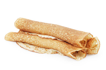 freshly baked rolled blinis or crepes isolated