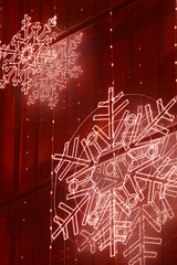 Christmas lights decoration on a building facade in red tone