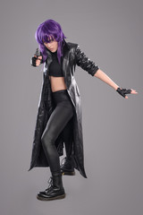 Woman with gun / Portrait of sexy woman posing in studio with gun