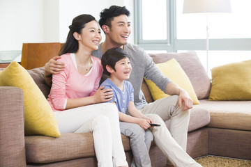 Happy family watching TV
