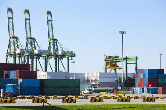 Cranes and cargo containers in shipping dock