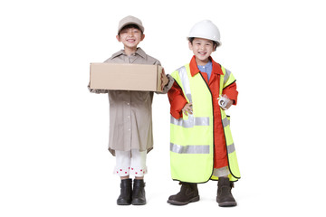 Boy and girl dressing up like delivery person and engineer