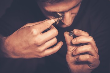 Portrait of a jeweler during the evaluation of jewels.