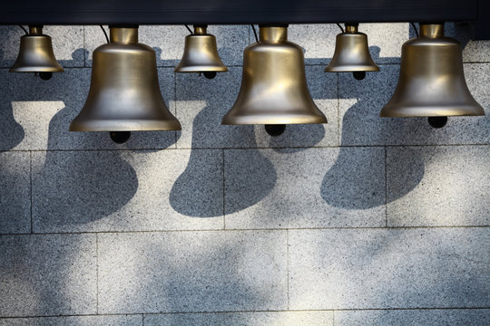 Various bells in a row