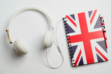 learn English concept with british flag and headphones. English school 