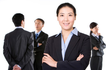 Businesswoman with business partners in background