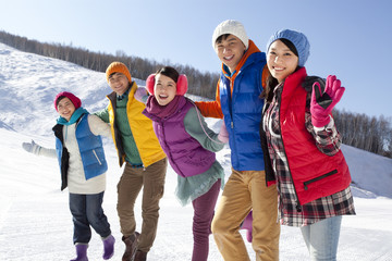 Happy young people in ski resort