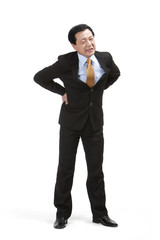 Senior businessman suffering from low back pain