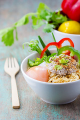 Chinese noodles with minced pork and egg in bowl