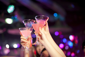 Stylish young people giving a toast