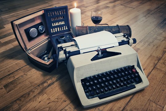 Typewriter and Cigar Box with Glass of Wine