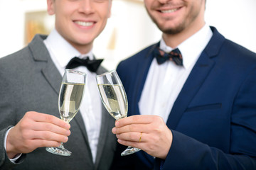 Happy guys celebrating wedding 
