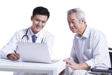 Doctor and patient seeing the results on laptop