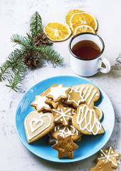 Cookies in the plate and mug of tea on white background.