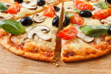 Sliced Pizza with mushrooms and vegetables