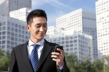 Businessman Using Mobile Phone