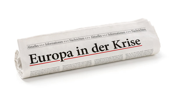 Zeitungsrolle mit der Überschrift Europa in der Krise
