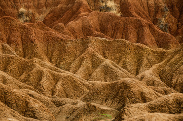 Detail of Drought red orange sand stone rock formation in Tatacoa desert, Huila