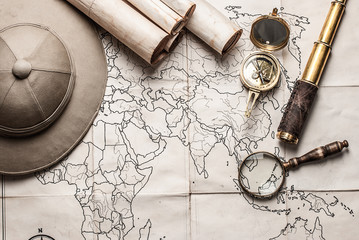 An old brass compass on map background