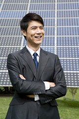 Portrait of a businessman in front of solar panels