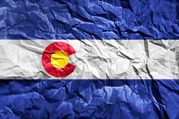Colorado flag painted on crumpled paper background