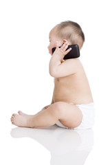 Cute baby boy on the phone