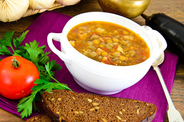 Lentil soup with eggplant, tomatoes and onions