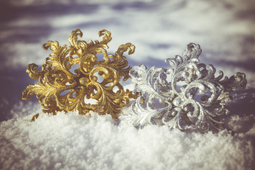 Gold and Silver Snowflake on Snow Retro