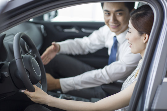 Young woman taking a test drive